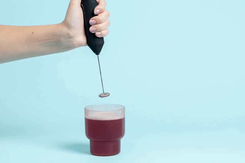 Mellow Mix being frothed into a glass